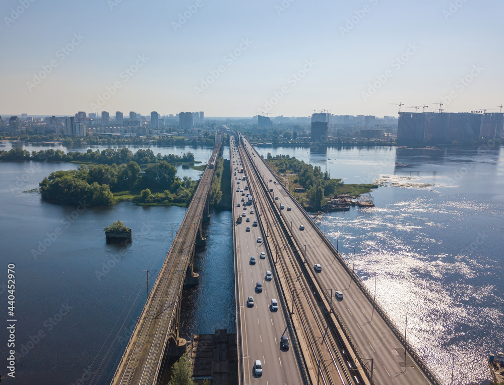 Darnitsky bridge in Kiev in sunny weather. Aerial drone view. Darnitsky bridge in Kiev in sunny weather. Aerial drone view.