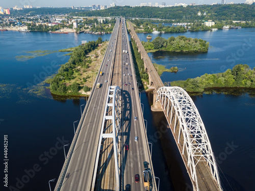 Darnitsky bridge in Kiev in sunny weather. Aerial drone view. photo