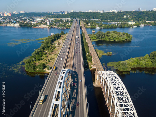 Darnitsky bridge in Kiev in sunny weather. Aerial drone view. photo