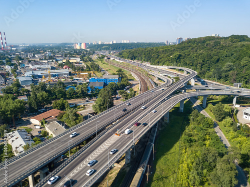 Darnitsky bridge in Kiev in sunny weather. Aerial drone view.