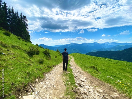 Young man hiking and exploring the world, passionate about nature and its perfect places