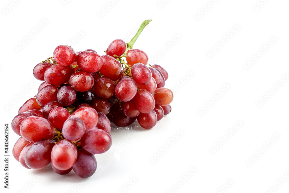 bunch of ripe and juicy red grapes isolated on white background