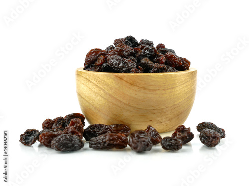 Black sweet Raisins or dried sweet grapes (kali kishmish or Zante currant) isolated on white background