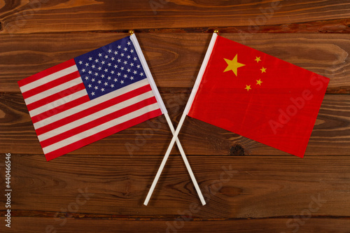 USA flag and China flag crossed with each other. USA vs China. The image illustrates the relationship between countries. Photography for video news on TV and articles on the Internet and media.