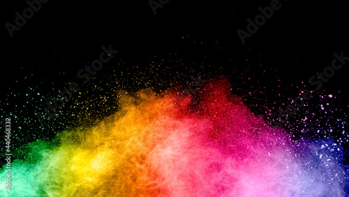 Abstract multicolored powder explosion on black background. © Pattadis