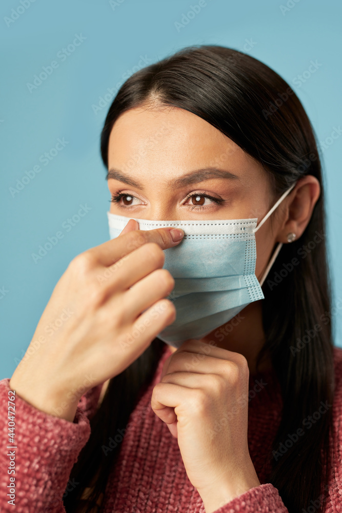 Beautiful brunette wearing a protective face mask Beautiful brunette wearing a protective face mask