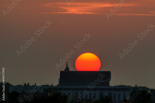 Wallpaper Mural Sunset over the city. Poland Bialystok. The photo was taken against the sun Torontodigital.ca