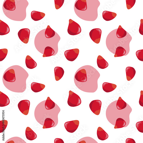 Pomegranate seeds seamless pattern. Colorfull red pomegranate seeds on the white background with red spots.