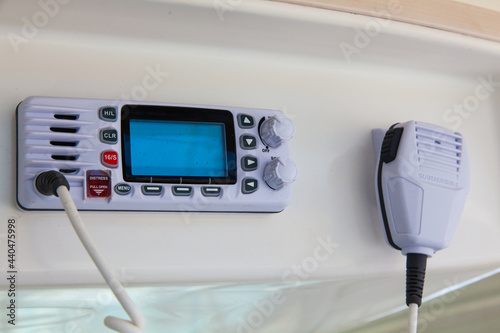 Walkie-talkie in the control cabin of a motor yacht. Radio station on a yacht. photo