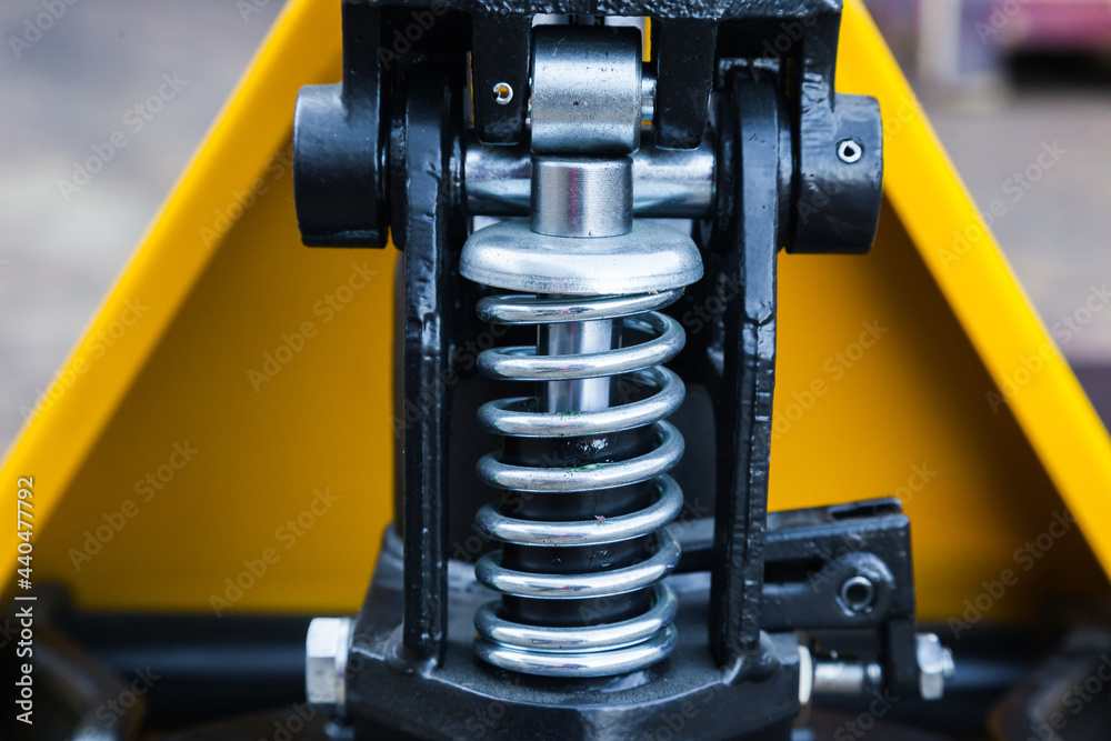 Lifting mechanism on a pallet truck, close-up.