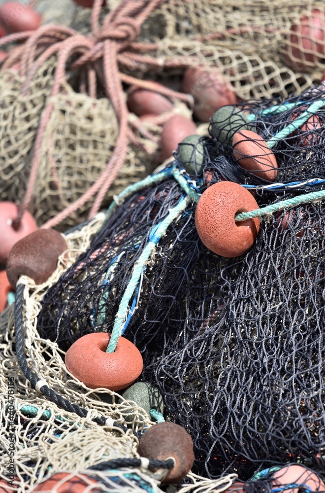 Fishing nets and floats close up, vertical image