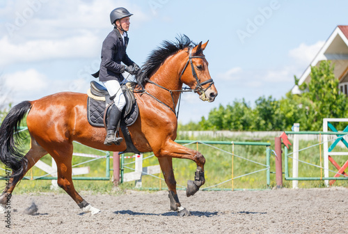 Young man on his course show jumping competition