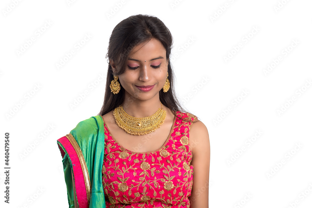 Beautiful Indian traditional girl posing on white background. Beautiful Indian traditional girl posing on white background.