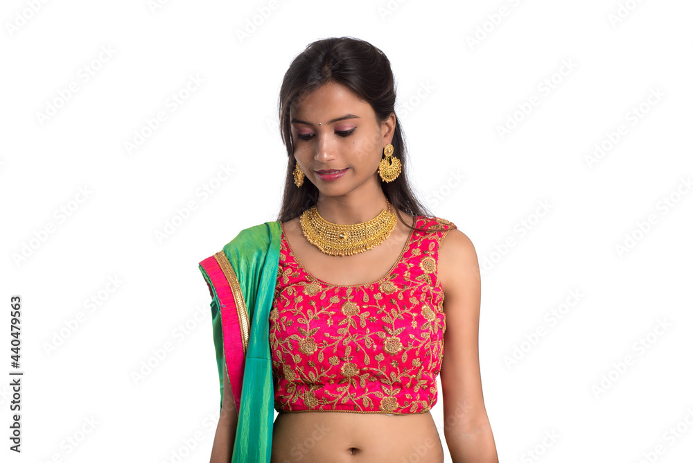 Beautiful Indian traditional girl posing on white background. Beautiful Indian traditional girl posing on white background.