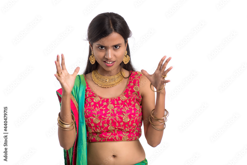 Beautiful Indian traditional girl posing on white background. Beautiful Indian traditional girl posing on white background.
