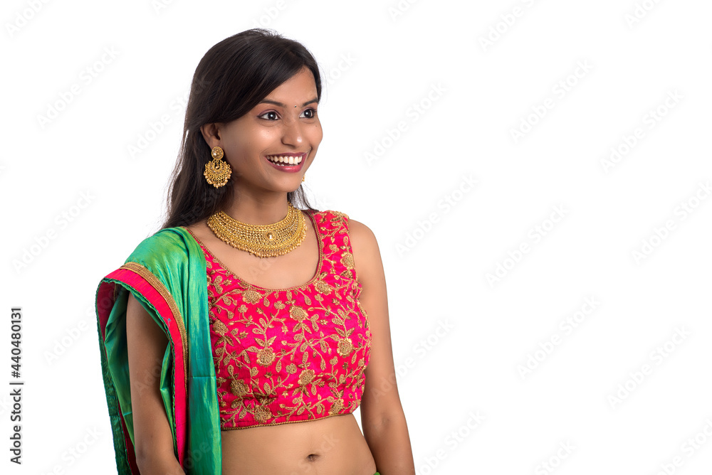 Beautiful Indian traditional girl posing on white background. Beautiful Indian traditional girl posing on white background.