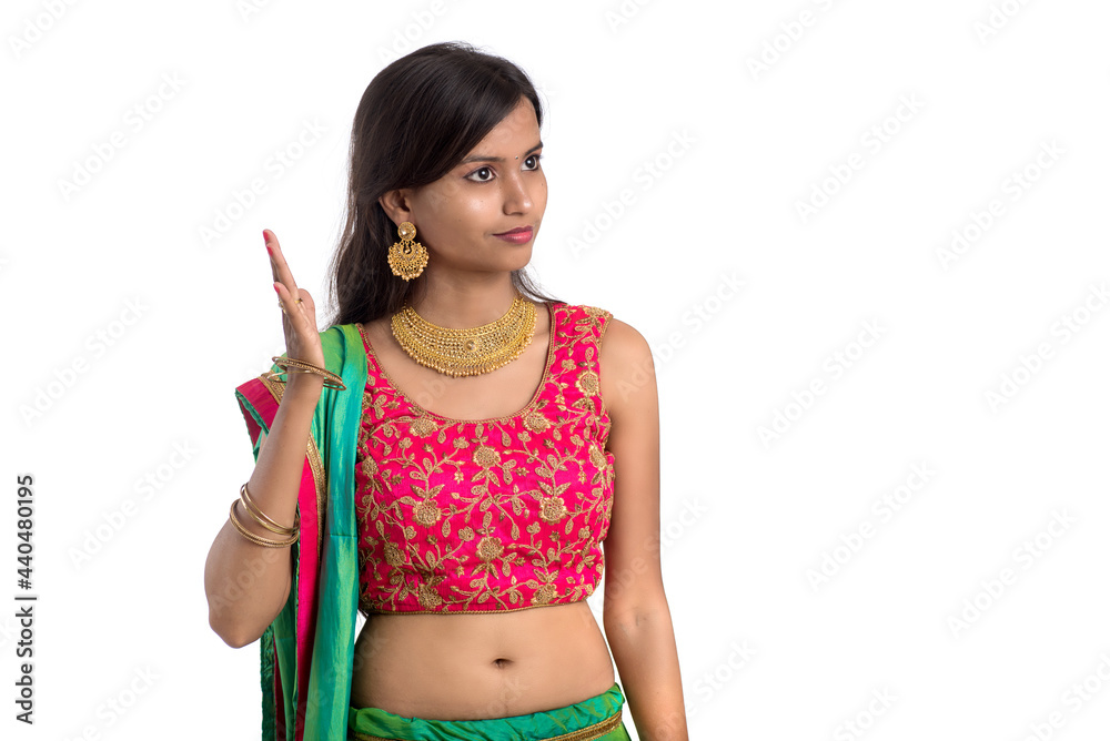 Beautiful Indian traditional girl posing on white background. Beautiful Indian traditional girl posing on white background.
