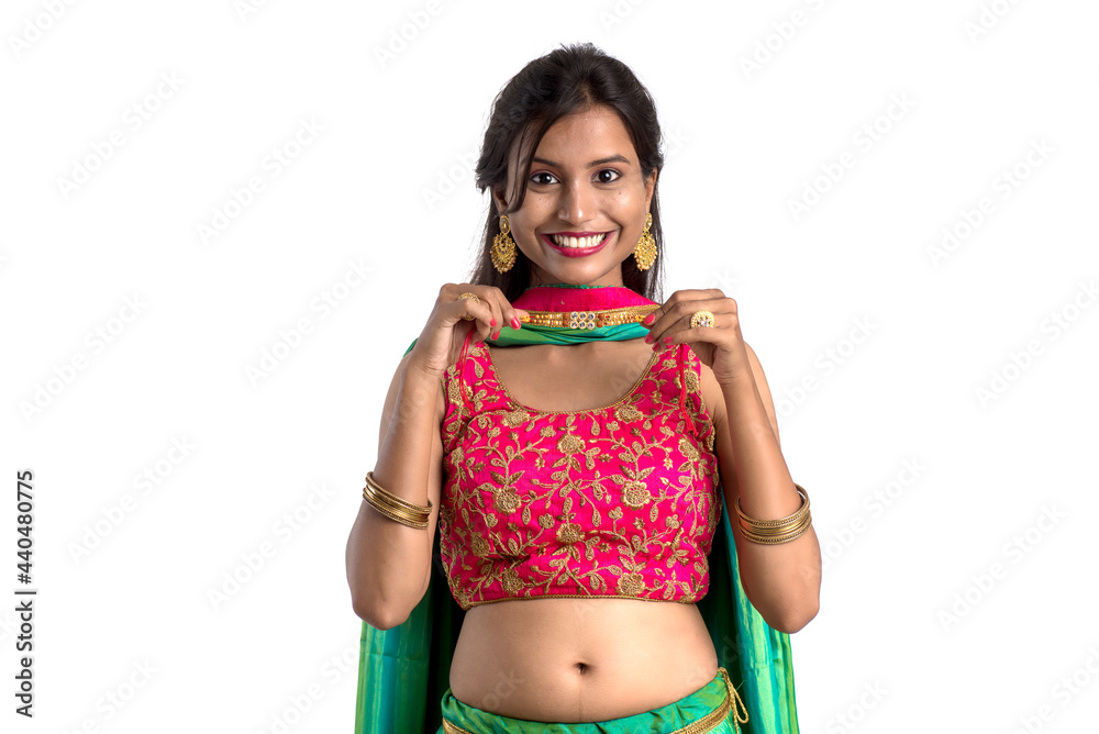 Beautiful girl showing Rakhi on occasion of Raksha bandhan on a white background. Sister tie Rakhi as symbol of intense love for her brother. Beautiful girl showing Rakhi on occasion of Raksha bandhan on a white background. Sister tie Rakhi as symbol of intense love for her brother.