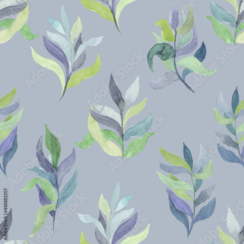 watercolor twigs with leaves of different colors on a colored background vector seamless pattern