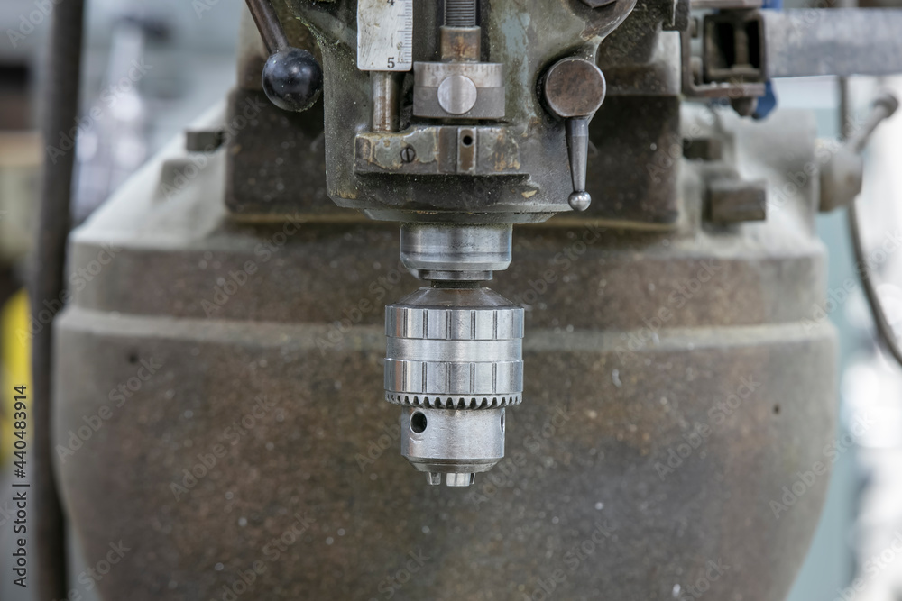 Close up shot of spindle head of drilling machine Close up shot of spindle head of drilling machine