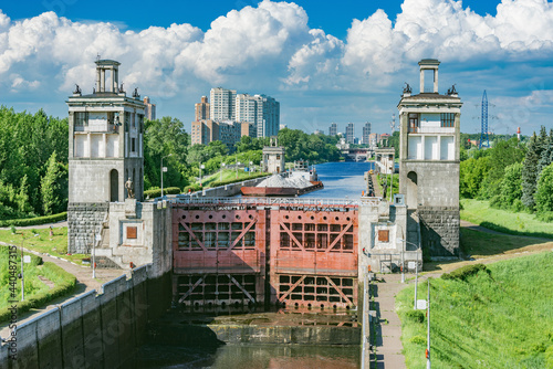 Freight ship moves through the gateway of the river. Moscow.