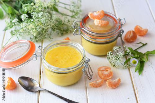 Canvastavla Delicate tangerine curd in a glass jar on a white table