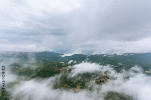 A view of Fluffy clouds and Mountains on a cold tropical morning.