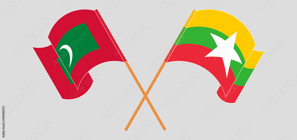 Crossed and waving flags of Maldives and Myanmar Crossed and waving flags of Maldives and Myanmar