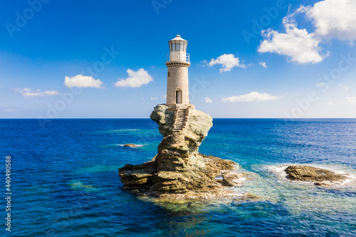 The beautiful Lighthouse Tourlitis of Chora at night. Andros island, Cyclades, Greece