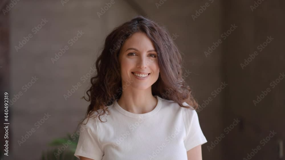 Beautiful woman home portrait alone happy female looking camera