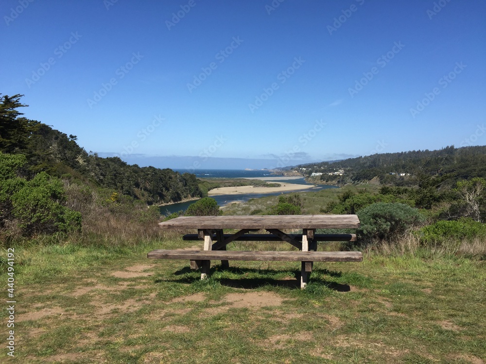 picnic bench overlooking the sea on a crisp morning picnic bench overlooking the sea on a crisp morning