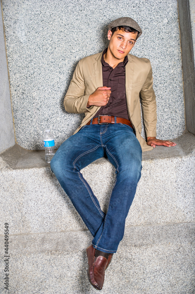 With a bottle of water, a young businessman is sitting there to take a break. With a bottle of water, a young businessman is sitting there to take a break.