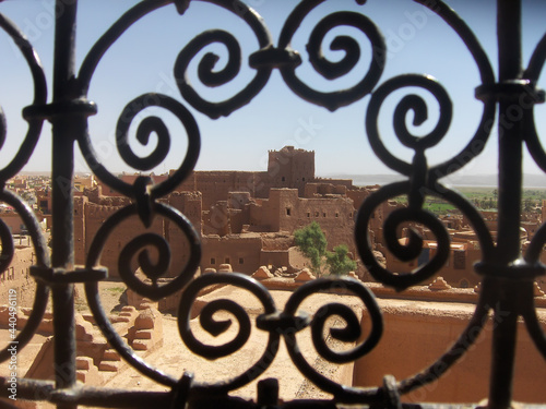 Ouarzazate seen through a window with Arabic design grate