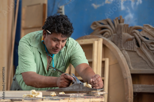 Mexican carpenter working in his workshop