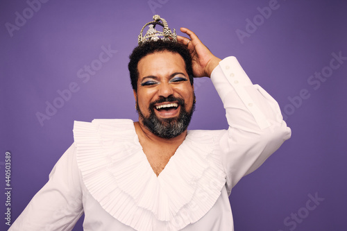 Portrait of a drag queen smiling with crown photo