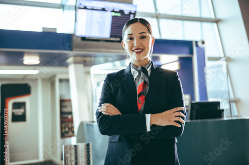 Confident flight attendant at international airport photo