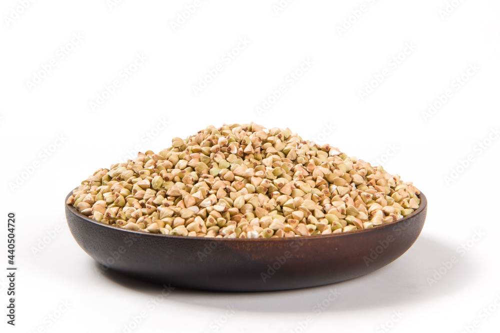 Pile of raw buckwheat isolated on white background. Pile of raw buckwheat isolated on white background.