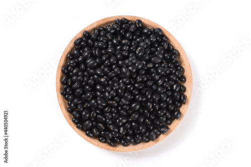 raw black soya bean in a bowl isolated on white background.