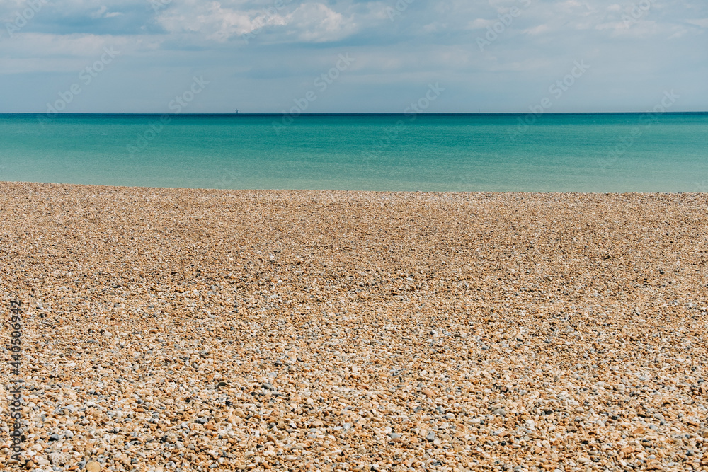 Deserted shingle beach in Eastbourne on the south coast of England. Deserted shingle beach in Eastbourne on the south coast of England.