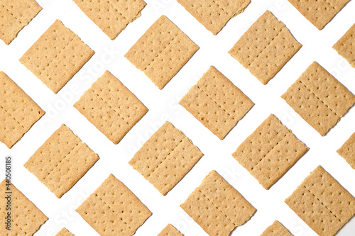 Pattern of graham crackers squares. Top view, flat lay, isolated on a white background