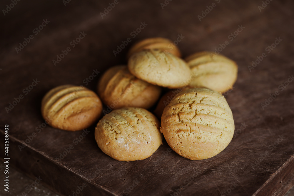 Stack of homemade cookies on wooden board. Baking in country kitchen. Stack of homemade cookies on wooden board. Baking in country kitchen.