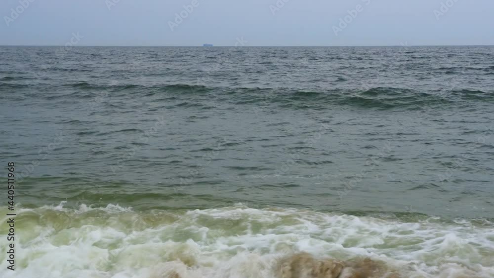 Large powerful blue wave breaks in the ocean Large powerful blue wave breaks in the ocean