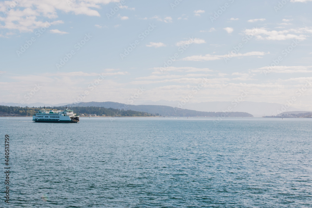 ferry boat on the Puget Sound on a sunny day with few clouds