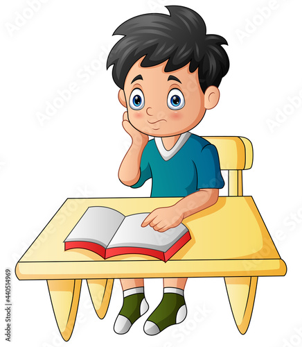 Cartoon illustration of boy learning on the desk