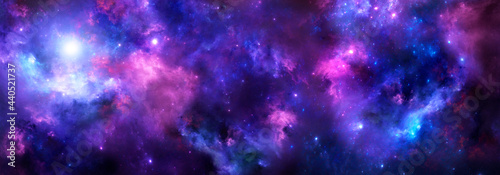 Space background with realistic purple nebula and shining stars.