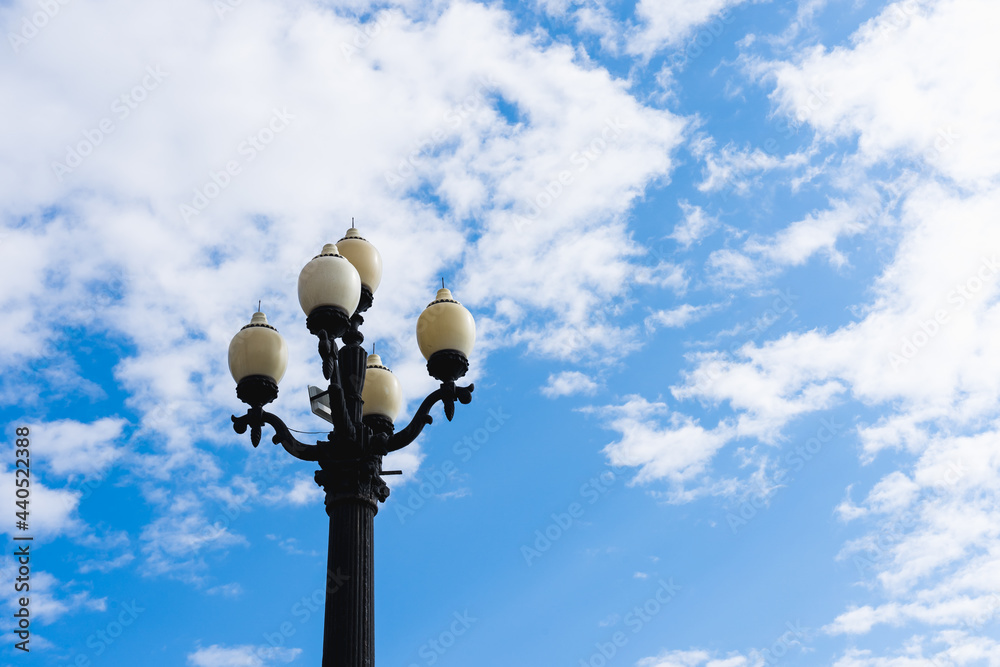 Old lantern on a background of sky with clouds with copy space Old lantern on a background of sky with clouds with copy space