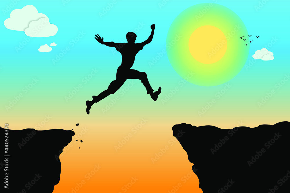 Silhouette of a person jumping at sunset. Man jumping between two mountains. Silhouette of a person jumping at sunset. Man jumping between two mountains.