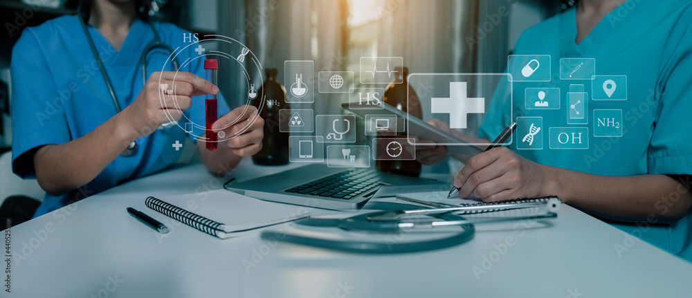 Medicine doctor touching on digital tablet and hologram modern virtual screen interface icons, Medical technology and futuristic concept. Medicine doctor touching on digital tablet and hologram modern virtual screen interface icons, Medical technology and futuristic concept.