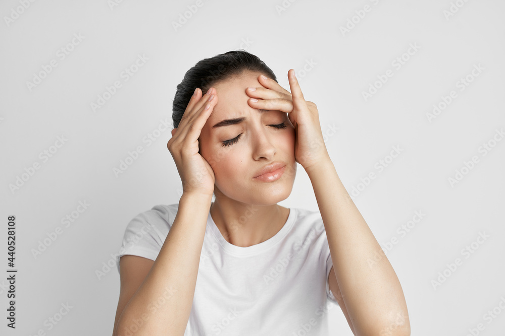 woman with headache holding her head migraine treatment health problem woman with headache holding her head migraine treatment health problem