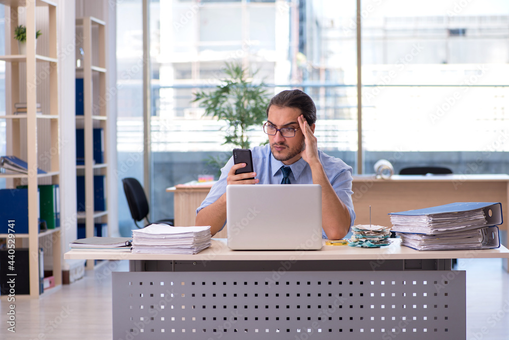 Young male accountant working in the office Young male accountant working in the office